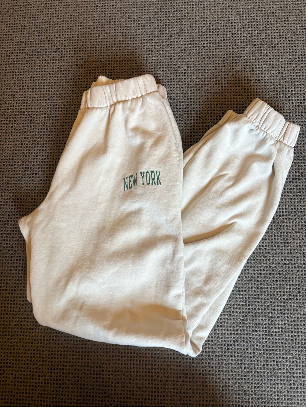 Brandy Melville Cream Joggers with Green "New York" Script